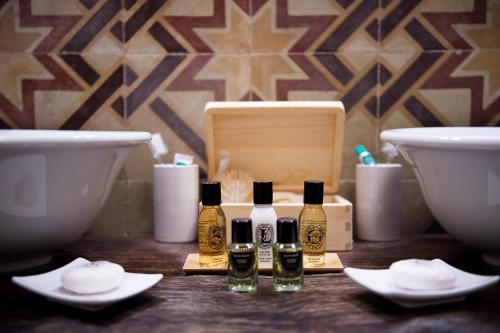 a group of four bottles of essential oils on a table at San Gemini Palace in San Gemini