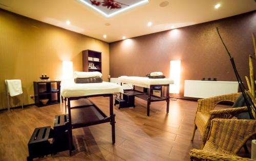 Una cama o camas en una habitación de Greno Hotel & Spa