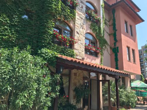 a building with flower boxes on the side of it at Oleander House and Tennis Club in Sunny Beach