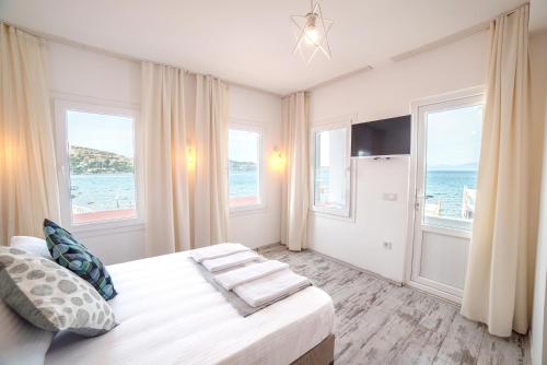 Postel nebo postele na pokoji v ubytování Madda Hotel