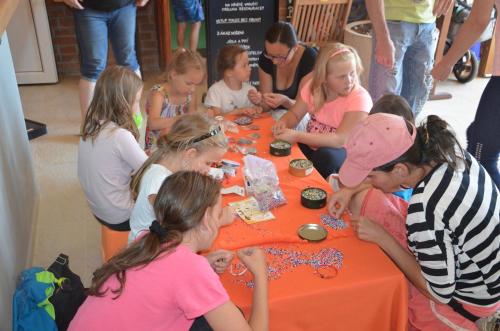 a group of children sitting around a table making crafts at Penzion Bejby Turnov in Turnov
