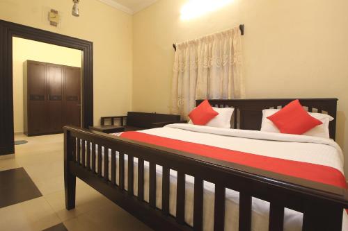 Ένα ή περισσότερα κρεβάτια σε δωμάτιο στο Temple Tree Residence