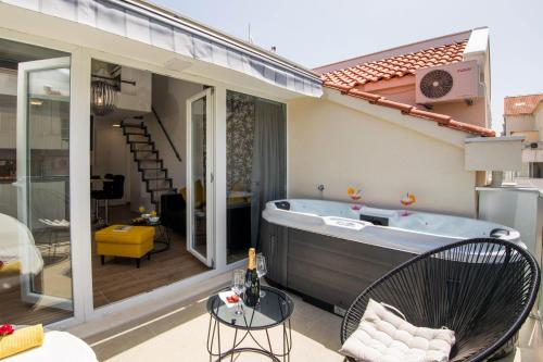 a hot tub on the patio of a house at Apartment Velvet in Dubrovnik