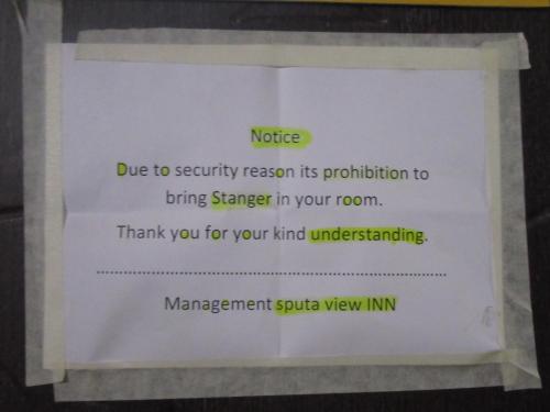a sign on a wall that readsride due to security reason its prohibition to at STUPA VIEW INN in Kathmandu
