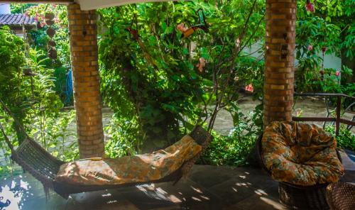 a pair of boots sitting in a garden at Pousada Morada do Sol in Canoa Quebrada