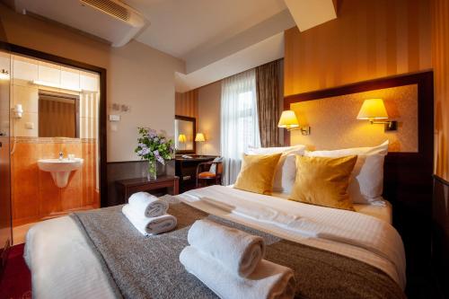 Posteľ alebo postele v izbe v ubytovaní Hotel Wielopole
