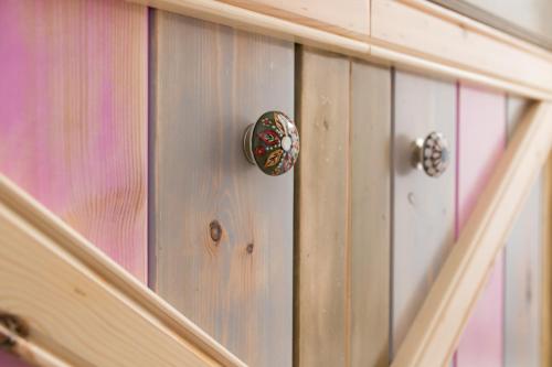 a close up of a wooden door with a knob at Gorgona Traditional Studio in Karpathos Town