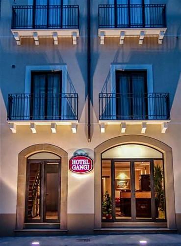 a building with two doors and a sign on it at Hotel Gangi in Piazza Armerina
