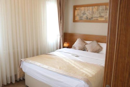 Cama o camas de una habitación en AKBAK OTEL