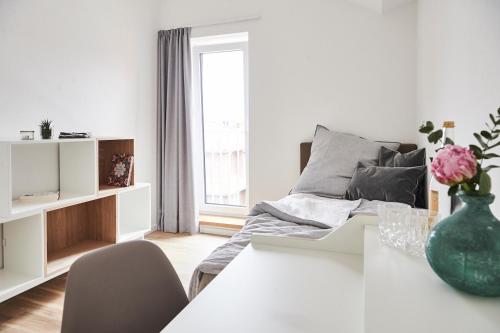 Postel nebo postele na pokoji v ubytování Boardinghome Oldenburg