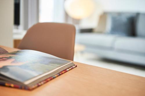 a book sitting on top of a wooden table at Boardinghome Oldenburg in Oldenburg