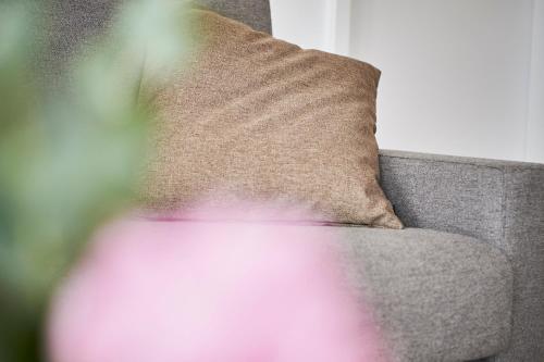 a couch with a pillow on top of it at Boardinghome Oldenburg in Oldenburg