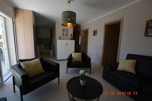 a living room with a couch and chairs and a table at Dreamlodge - Luxe Dalmatian Villa, private pool, parking, mooring, breathtaking sea & mountain view, at 150 m from idyllic private beach in Rogač