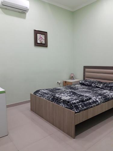 a bedroom with a large bed in a room at Hostel City Center in Kutaisi