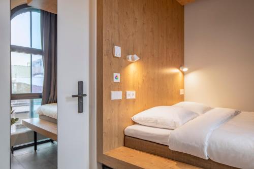 Ένα ή περισσότερα κρεβάτια σε δωμάτιο στο Bunk Hotel Utrecht