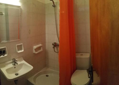 a bathroom with a toilet and a sink at Armyra Hotel in Skala
