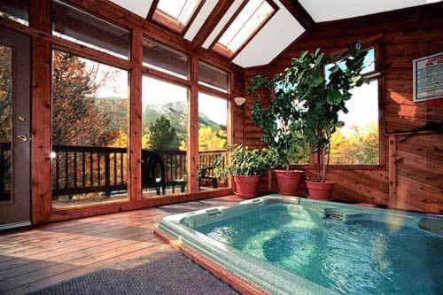 a room with a jacuzzi tub in a house at Wildwood Inn in Estes Park