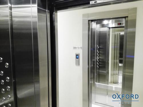 a stainless steel refrigerator next to a wall at Oxford Hotel in Montevideo