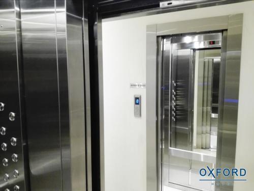 a stainless steel refrigerator in a small room at Oxford Hotel in Montevideo