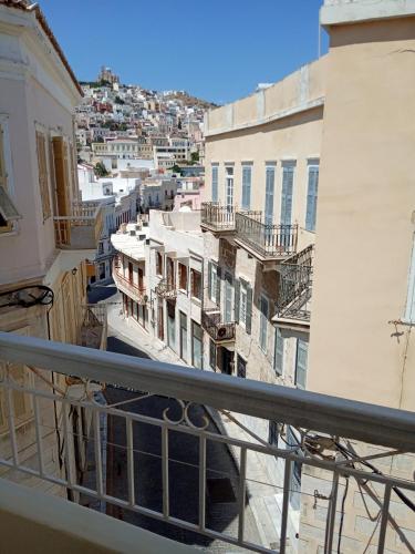 a view from a balcony of buildings at ERRIKA in Ermoupoli