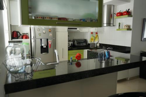 a kitchen with a sink and a counter top at Posada Ventura in Duitama