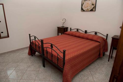 Ein Bett oder Betten in einem Zimmer der Unterkunft Casa Vacanze - Affittacamere Il Tempone