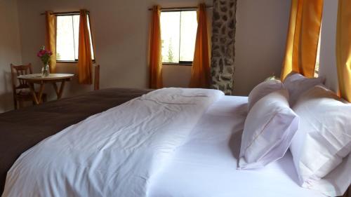 Voodi või voodid majutusasutuse Casa Inka B&B toas