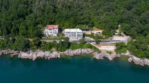 an aerial view of a building on an island in the water at Boutique Hotel Acacia in Lovran