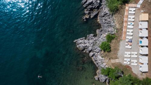 an aerial view of a beach and the water at Boutique Hotel Acacia in Lovran