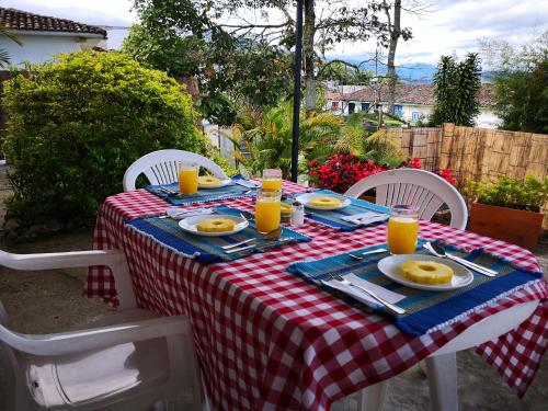 a table with a red and white checkered table cloth at Hotel Salento 1842 in Salento