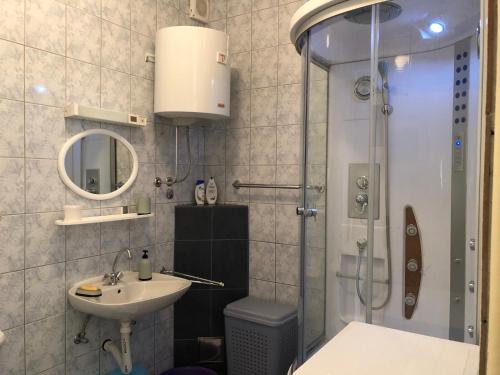 a bathroom with a shower and a sink at Apartmani Milan in Trebinje