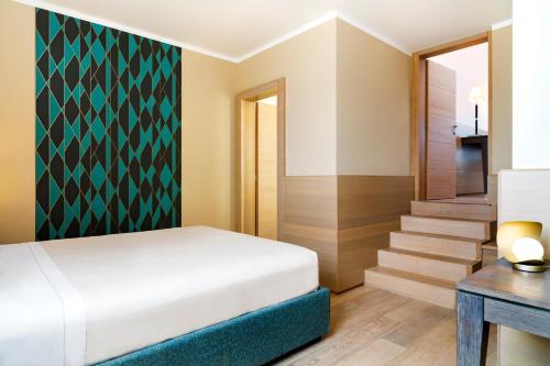 Ένα ή περισσότερα κρεβάτια σε δωμάτιο στο Grand Hotel Alassio Beach & Spa Resort - The Leading Hotels of the World
