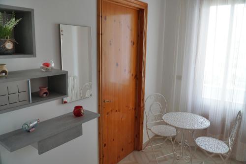 a kitchen with a table and a table and chairs at SALENTO DA INCANTO in Spongano