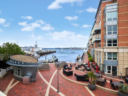 a view of the water from a balcony of a building at Battery Wharf Hotel, Boston Waterfront in Boston
