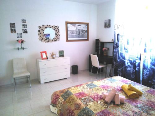 a bedroom with a bed and a dresser and a desk at Dolce Risveglio in San Valentino in Abruzzo Citeriore