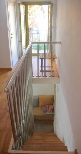 a stairway with a bench and a window at EVANNA HOUSE in Symi
