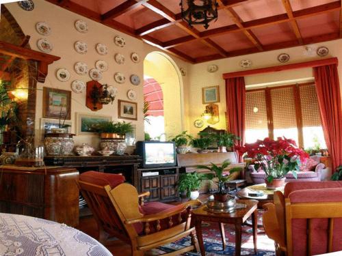 a living room with a couch and a table at Hotel Villa Pina Antico Francischiello in Massa Lubrense