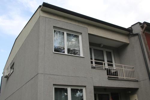 a building with two windows at Apartman KEJ in Pirot