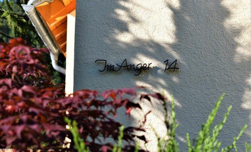 a writing on the side of a wall with flowers at FVH Family Vacation Heidelberg in Heidelberg