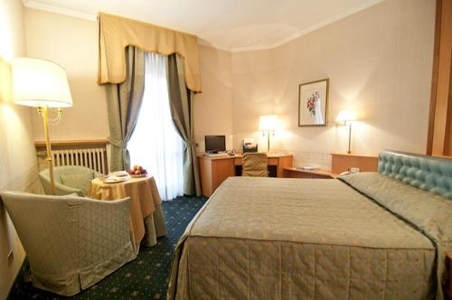 เตียงในห้องที่ Hotel Ristorante Al Sorriso