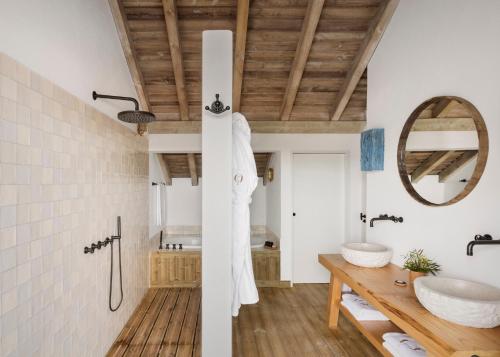 a bathroom with a sink and a mirror at Quinta Da Comporta - Wellness Boutique Resort in Comporta