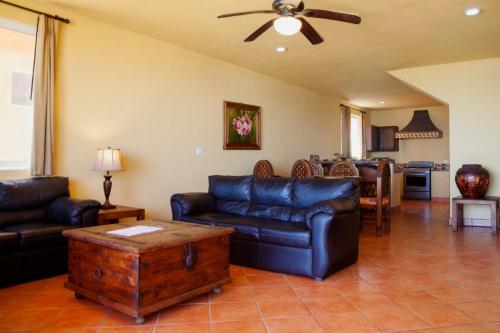 a living room with a couch and a table at Cerritos Surf Town - Beach Front Property in El Pescadero