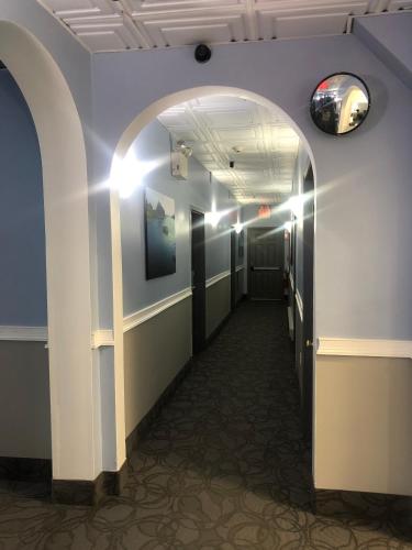 a hallway with an archway in a building at The Atlantic House in Narragansett