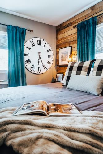 a bedroom with a large clock on the wall at West Davis Mill in Culpeper