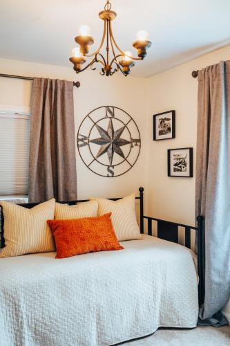 a bedroom with a bed with a large clock on the wall at West Davis Mill in Culpeper