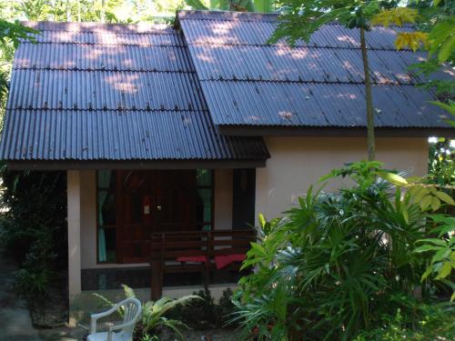 a house with blue solar panels on the roof at Aonang Green Park Bungalow in Ao Nang Beach