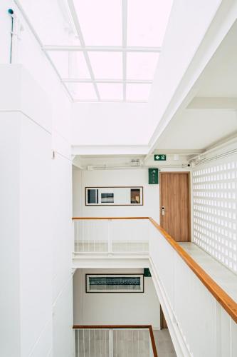 a staircase in a building with a skylight at HOMM Boutique Hotel in Chiang Mai