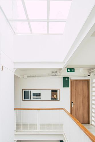 a room with a skylight and a door at HOMM Boutique Hotel in Chiang Mai