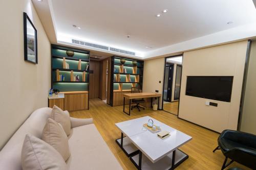 TV a/nebo společenská místnost v ubytování Atour Hotel (Dongying Huanghe Road)
