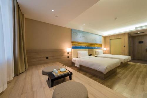 Postel nebo postele na pokoji v ubytování Atour Hotel (Dongying Huanghe Road)